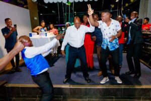 Simba Group staff along with Board Chairman, Patrick Bitature dancing at the End-of-Year Party